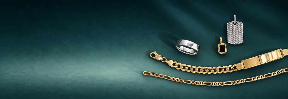 Men's gold ring, dog tag pendant, ID bracelet and chains on a dark teal background