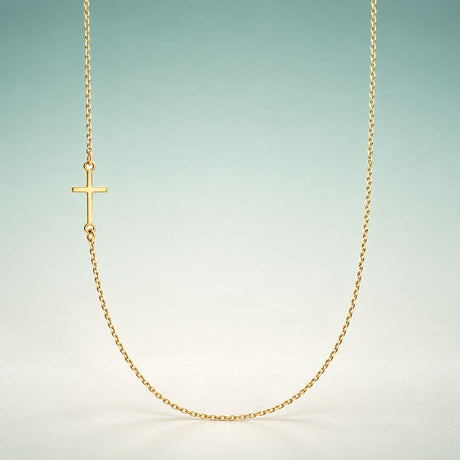 Yellow gold sideways cross necklace