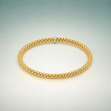 Stylish and elegant Stretch Bangle Bracelet with a golden textured design.