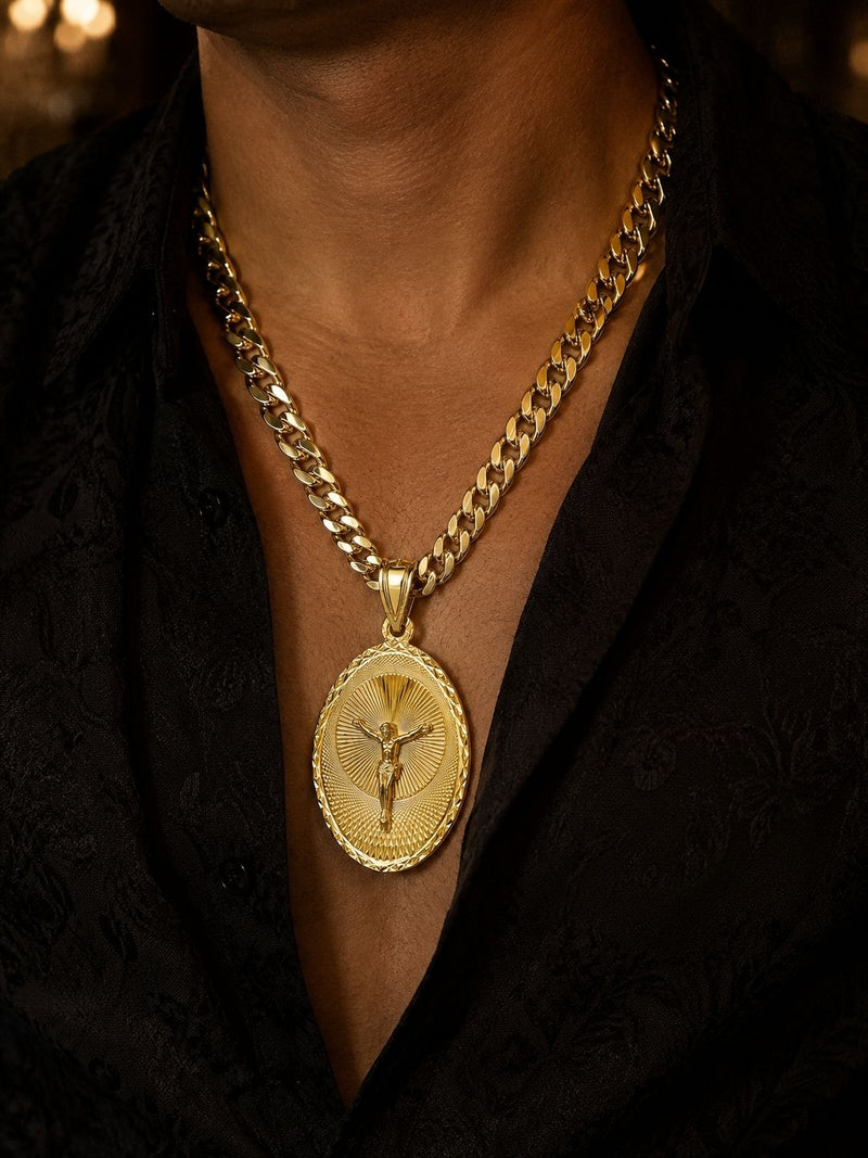 Man wearing a gold Cuban chain with an oval crucifix medallion