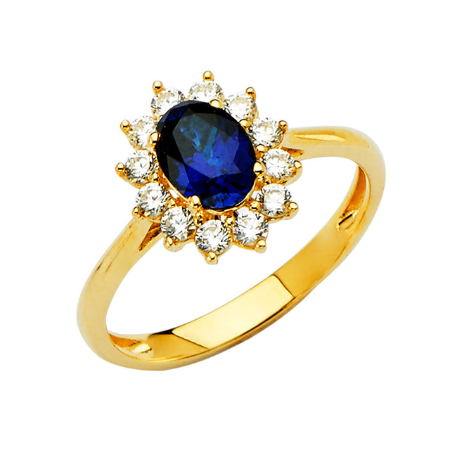 14K Yellow Gold Oval Simulated Blue Sapphire Starburst Halo Ring on White Background