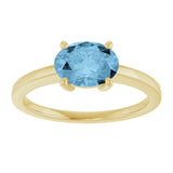 10K Gold Oval Natural Sky Blue Topaz Solitaire Ring - Yellow Gold - view 3