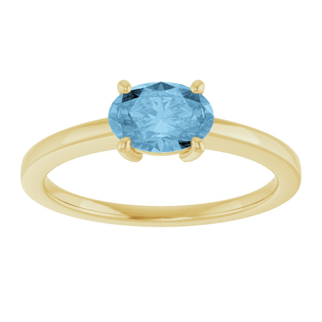 10K Gold Oval Natural Sky Blue Topaz Solitaire Ring - Yellow Gold - view 3