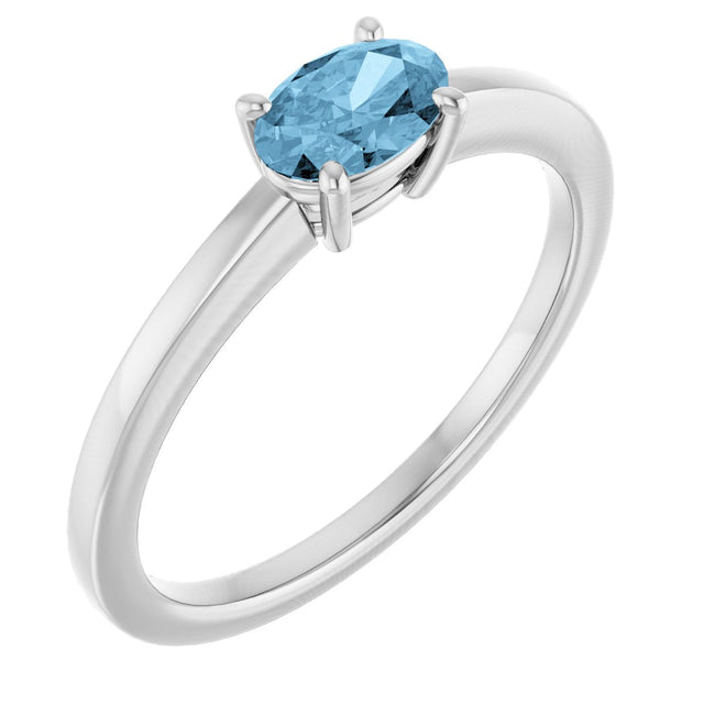 10K Gold Oval Natural Sky Blue Topaz Solitaire Ring - White Gold