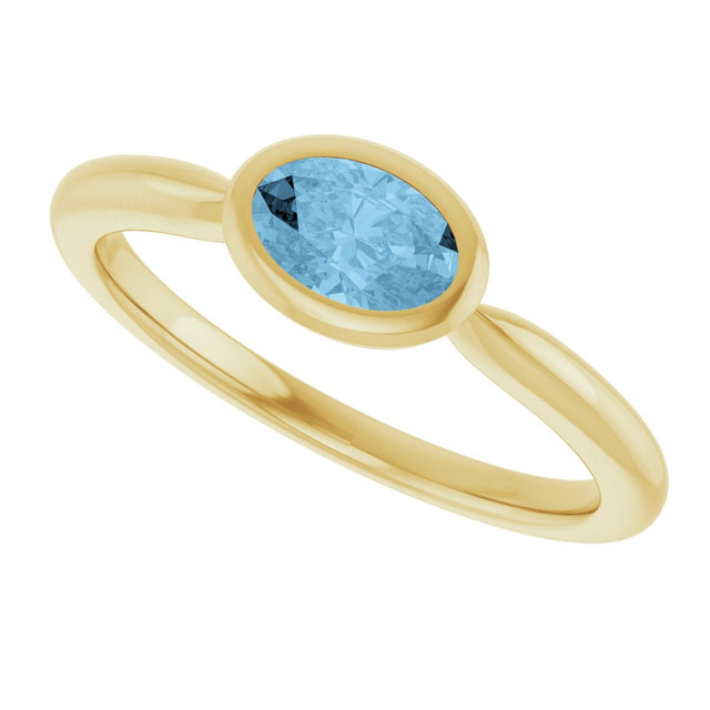 10K Gold Oval Natural Sky Blue Topaz Bezel-Set Solitaire Ring - Yellow Gold - view 5