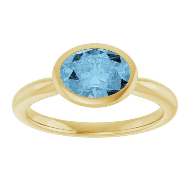 10K Gold Oval Natural Sky Blue Topaz Bezel-Set Solitaire Ring - Yellow Gold - view 3