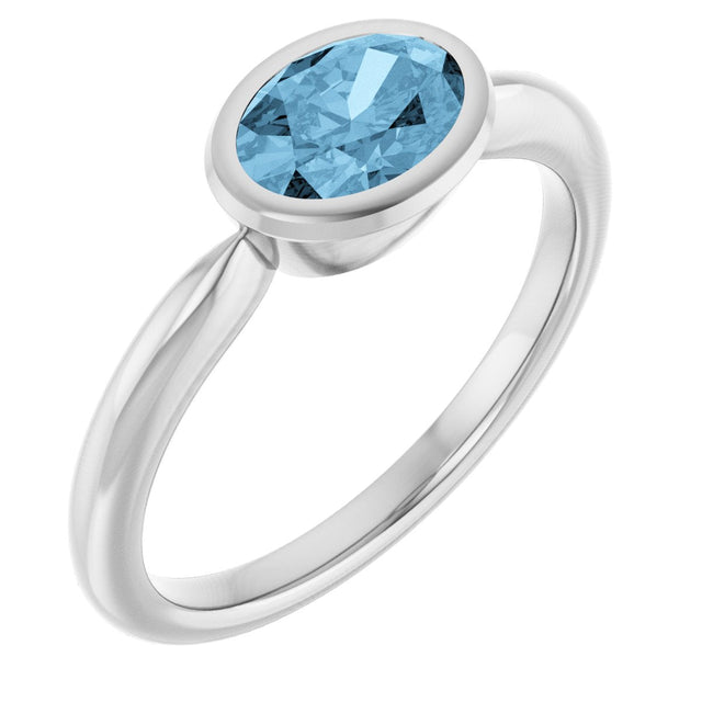 Platinum Oval Natural Sky Blue Topaz Bezel-Set Solitaire Ring