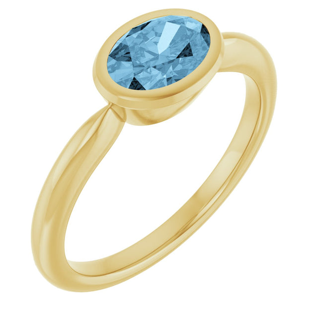 10K Gold Oval Natural Sky Blue Topaz Bezel-Set Solitaire Ring - Yellow Gold