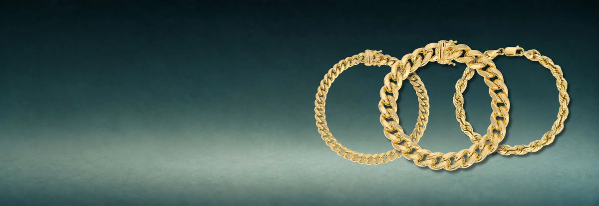 Three yellow gold Cuban link bracelets on a dark teal background