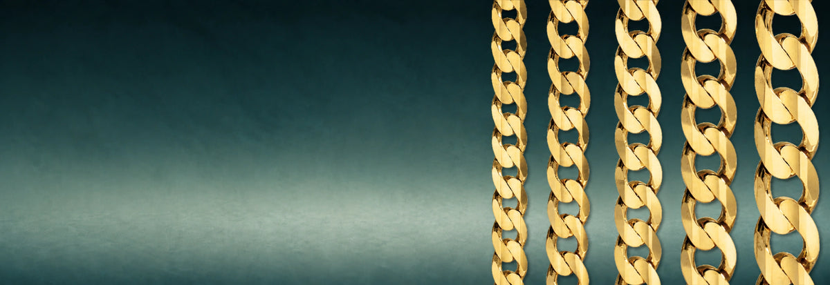 Yellow gold Cuban link chains on a dark teal background