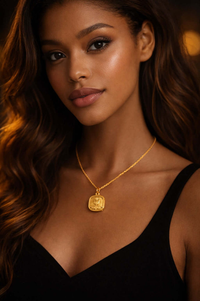 14k gold communion cup pendant worn by a model showcasing its elegance and shine.