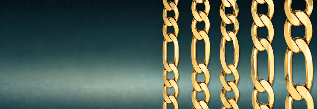 Yellow gold Figaro chains on a teal background